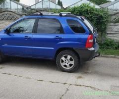 Kia Sportage și Ford c max